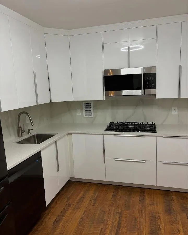 Restored kitchen with white cabinets after water damage in Walnut Park